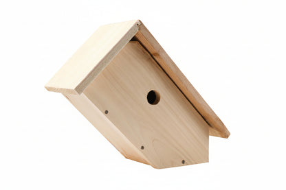 Wooden birdhouse with a triangular roof on a white background