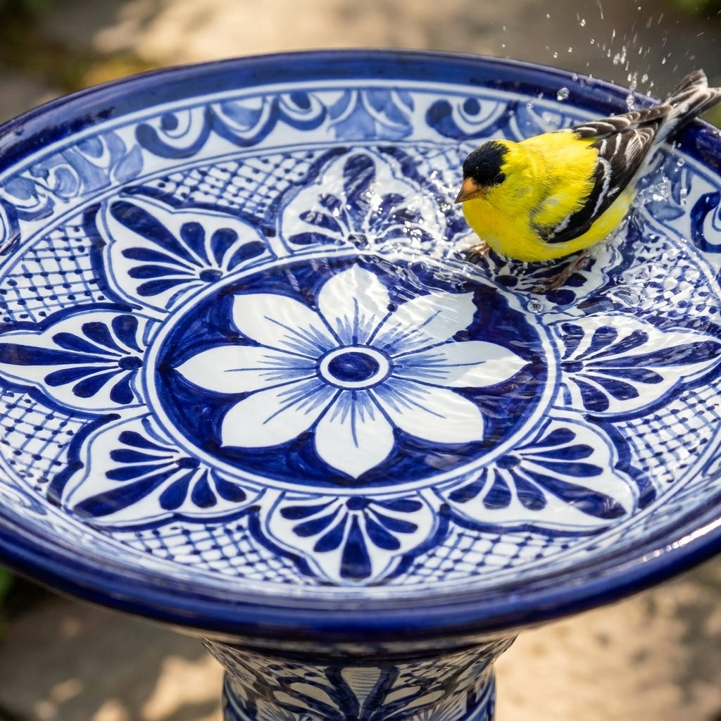Close-up of the Cobalt Blue & White hand-painted Talavera ceramic basin with an American Goldfinch splashing in the water