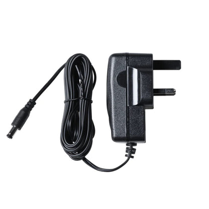 Black power adapter with cable on a white background