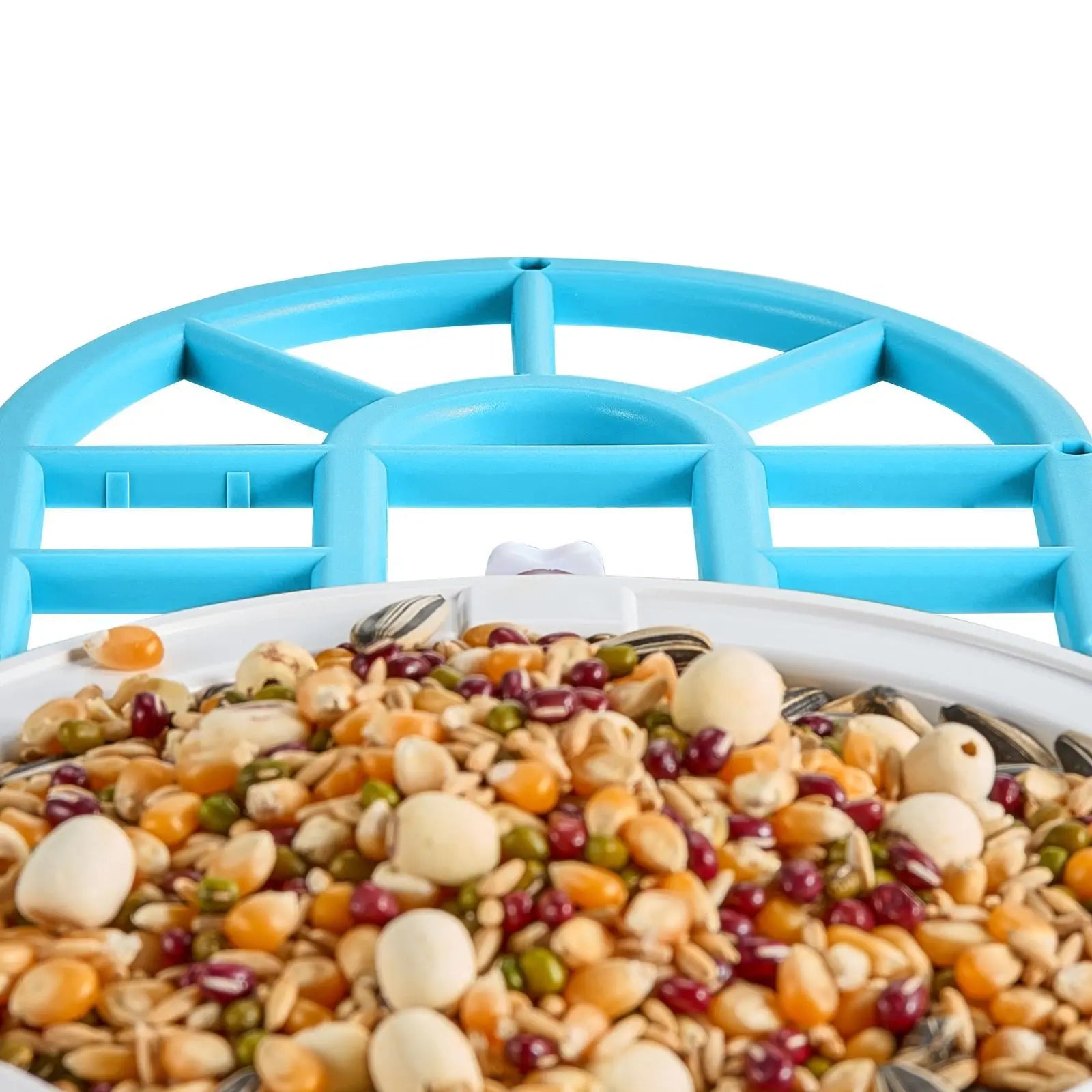 Perch tray and seed hopper of the smart bird feeder filled with mixed seed