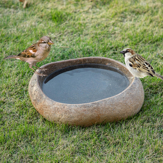 Large natural river stone bird bath, handcarved basin approximately 18-20 inches wide