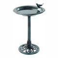 A dark green cast iron pedestal birdbath with a decorative bird perched on the rim, shown against a plain white background.