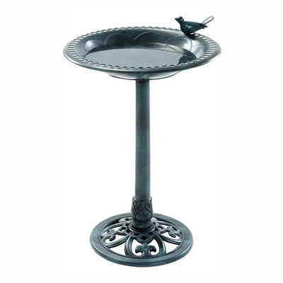A dark green cast iron pedestal birdbath with a decorative bird perched on the rim, shown against a plain white background.