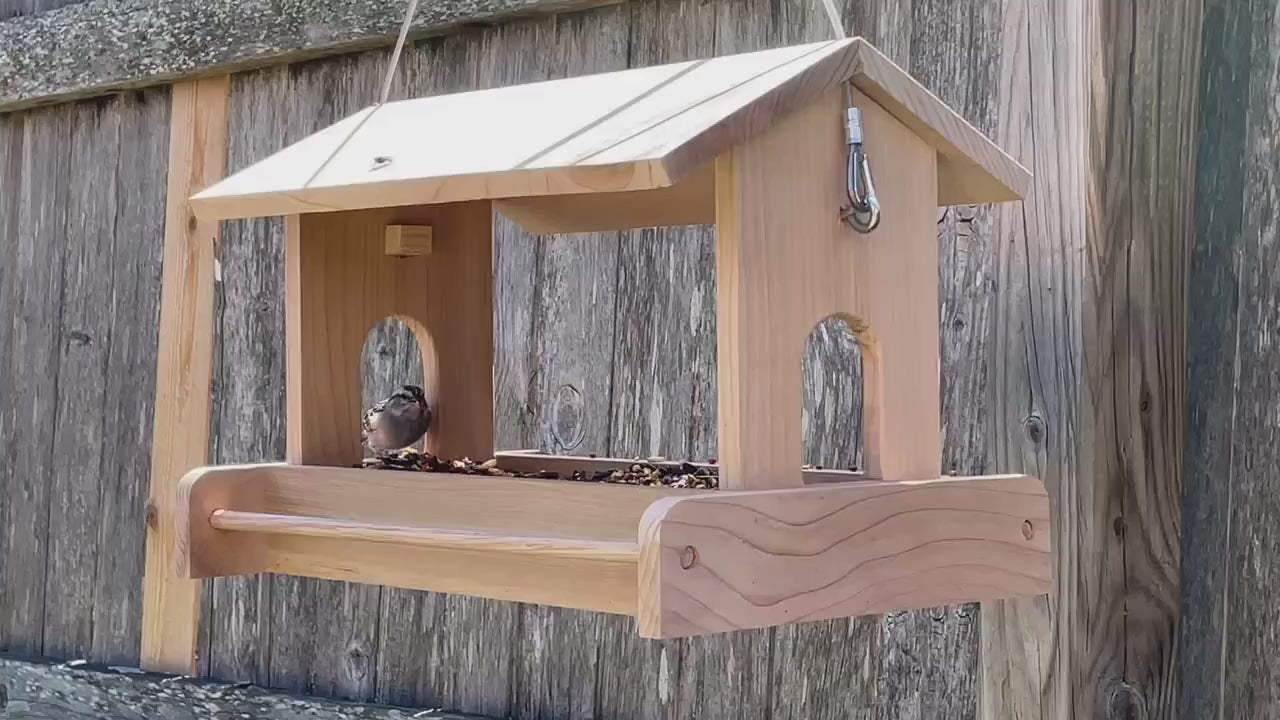 Large, handmade fly through feeder with high capacity seed tray.mp4
