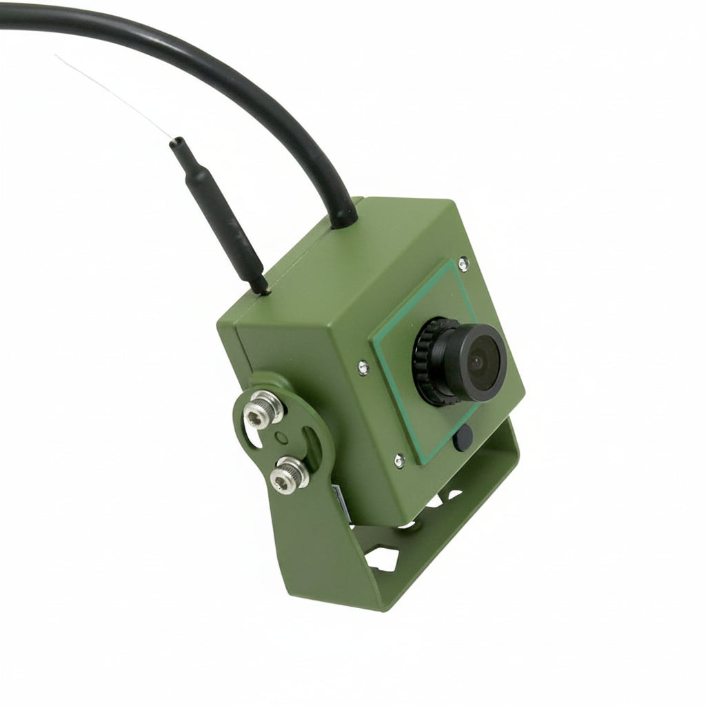 Green camera with a cable on a white background