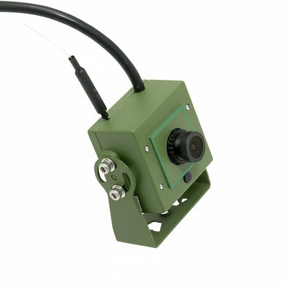 Green camera with a cable on a white background